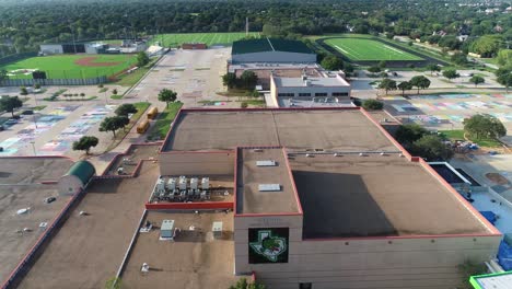 Aerial-video-flying-over-Southlake-Carroll-Senior-High-School-and-parking-lot