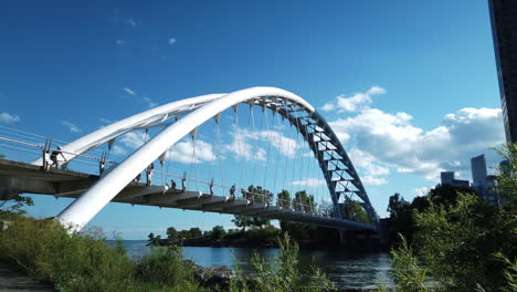 Low-wide-shot-looking-westward-at-the-busy-Humber-Bay-Arch-Bridge