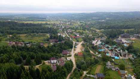 Aerial-drone-view-overlooking-a-town,-in-the-Carpathian-Mountains,-Ukraine