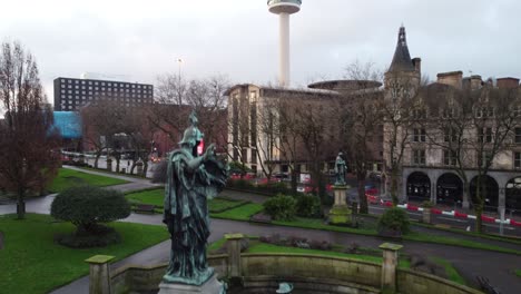 Rising-above-St-Georges-hall-museum-Kings-regiment-statue-historic-landmark-Liverpool-city-skyline