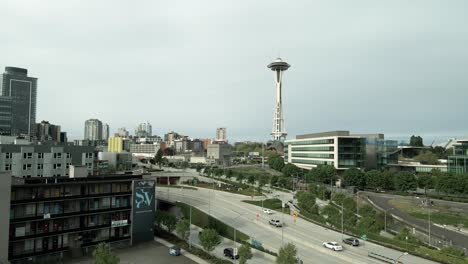 A-small-homeless-encampment-just-a-short-distance-from-the-iconic-Seattle-Center-and-Space-Needle,-aerial-push