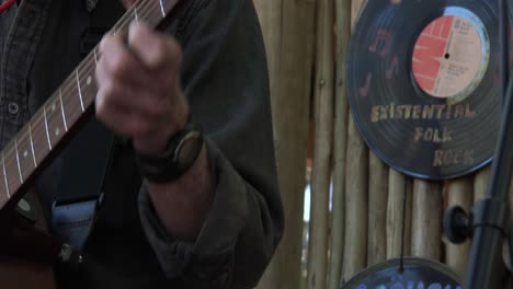 Close-up-of-a-guitarists-hand-changing-chords-on-the-neck