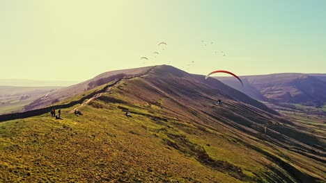 Spectacular-Aerial-View-Of-Paragliders-Flying-Thermals-Towards-Camera