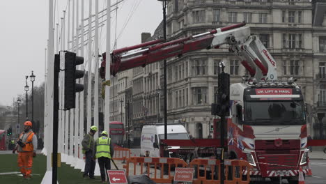 Workers-Installing-Flagpole-In-Parliament-Square-Gardens