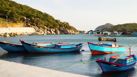 Small-boats-in-fishing-harbor-simple-serene-marine-Vinh-Hy-Bay-scenery,-Vietnam
