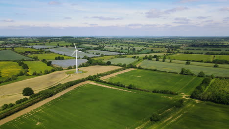 Wind-power-turbine-generating-clean-renewable-energy-in-green-English-countryside-landscape