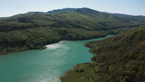 Sunlight-glistens-off-surface-of-Maneciu-Dam-Lake-in-Romania