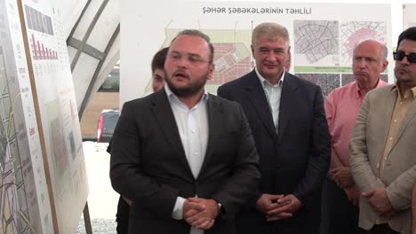 International-delegation-listen-to-presentation-about-reconstruction-of-the-city-of-Agdam-during-a-tour-of-Agdam-in-Nagorno-Karabakh,-Azerbaijan