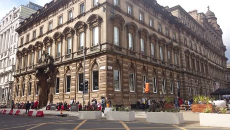 A-group-of-guys-about-to-cross-a-busy-city-centre