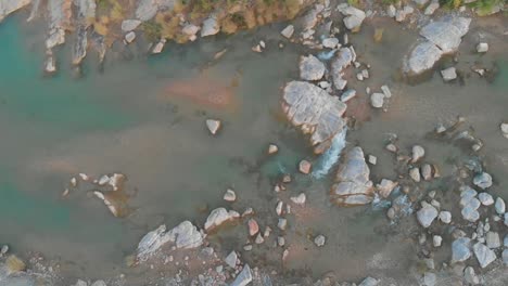 Aerial-Top-Down-View-Of-River-Going-Through-Rocks-In-Balochistan
