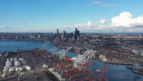 Aerial-view-flying-over-the-Port-of-Seattle-towards-the-city-skyline