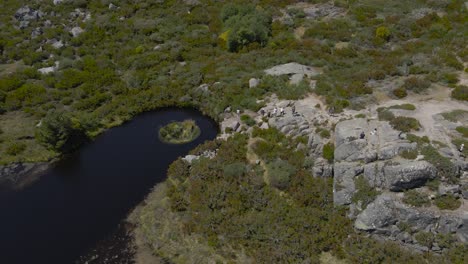 A-drone-pulls-back-from-an-overview-of-the-Covão-dos-Conchos-in-the-Serra-Da-Estrela