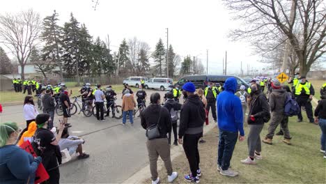 Line-of-police-with-bike-blocking-access-on-the-road