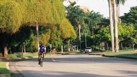 Recreational-cyclists-enjoying-an-early-morning-ride-along-the-Amador-Causeway-Boulevard,-a-popular-destination-for-people-who-enjoy-the-sunshine-and-live-an-active-outdoor-lifestyle,-Panama-City