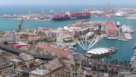Genoa-city-harbor-with-massive-container-vessel,-aerial-cinematic-view