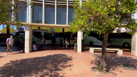 People-waiting-for-a-bus-on-main-bus-station-in-Huelva,-Spain