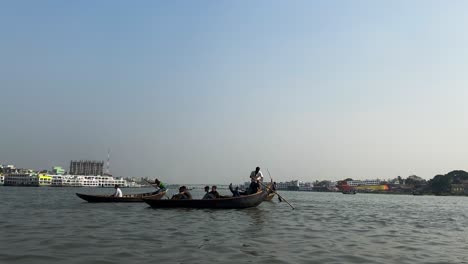 Local-boatmen-crossing-the-Buriganga-river-with-their-traditional-boat-taxis