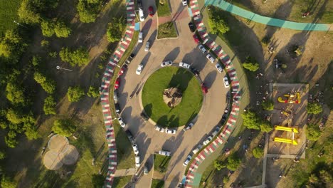 Rotating-top-down-aerial-view-of-roundabout-during-sunset