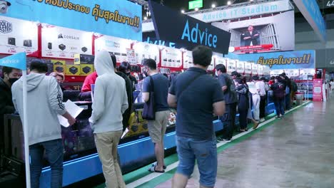 People-walking-and-shopping-in-Commart-Thailand-2022-computer-technology-event-at-Bitec-Bangna-Bangkok,-Thailand