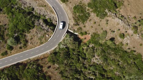 Aerial-following-a-VW-Camper-van-from-above-in-Bird-view-on-Madeira,-Portugal