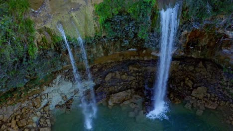 Cascading-twin-falls-into-freshwater-pool,-Caribbean