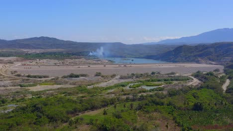 Panoramic-Aerial-View-of-Construction-of-Presa-Monte-Grande-Dam-Wall-Under-Completion-in-Dominican-Republic