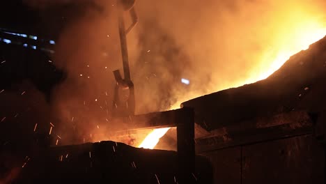 industrial-safety-first-concept,-casting-foundry,-Foundry---molten-metal-poured-from-ladle