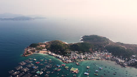 Aerial-Drone-Shot-Panning-Down-with-Scenic-Views-of-Fishing-Village-on-Binh-Hung-Island-in-Vietnam