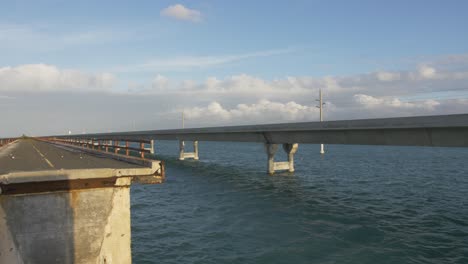 seven-7-mile-bridge-florida-keys-marathon-gulf-of-mexico-atlantic-ocean-waves-blue-slow-motion
