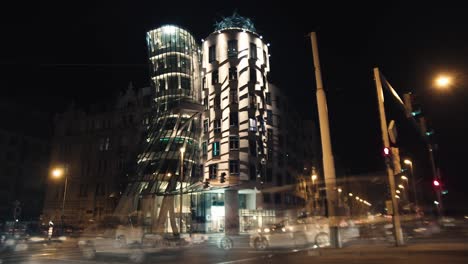 Time-lapse-city-landscape-and-traffic-illuminated-Dancing-house-Nationale-Nederlanden-building-at-night