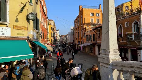 First-person-view-walking-over-Ponte-Delle-Guglie-bridge,-Venice-in-Italy