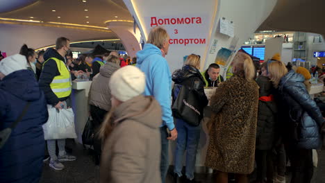 2022-Russian-invasion-of-Ukraine---Central-Railway-Station-in-Warsaw-during-the-refugee-crisis---people-waiting-for-transport-to-other-destinations