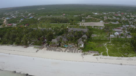 Tropical-bungalow-resort-with-white-sand-beaches-and-palm-trees