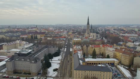 Aerial-panorama-of-Olomouc-city-in-Moravia-covered-with-snow-in-winter,-view-of-St