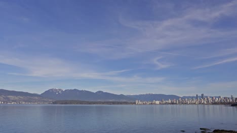 Vancouver,-BC-British-Columbia,-Canada-daytime-Timelapse,-Downtown-looking-at-Stanley-Park,-Downtown-and-the-North-Shore-Mountains