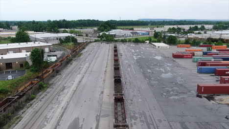 An-aerial-view-of-large-cranes-in-a-cargo-train-shipping-yard-in-Jefferson-County,-Kentucky