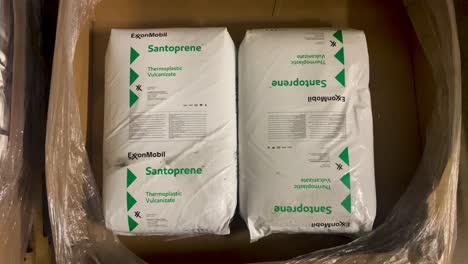 Two-plastic-bags-of-ExxonMobil-Santoprene-thermoplastic-vulcanizates-inside-cardboard-box