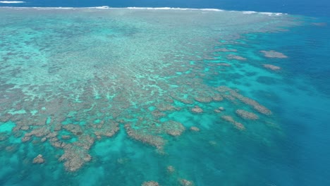 Great-Barrier-Reef-landscape-aerial-of-colorful-coral-and-turquoise-ocean,-near-Cairns,-Queensland,-Australia