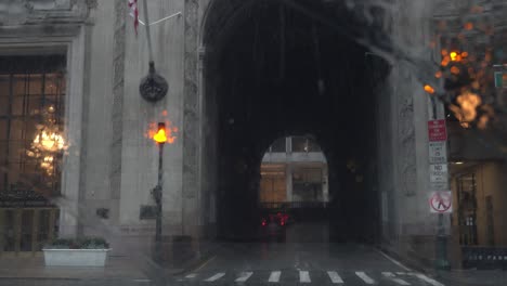 POV-Driving-around-the-Helmsley-Building-in-rainy-New-York-City