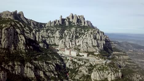 Aerial-Montserrat-Mountain-Range-With-Santa-Maria-Abbey-Monastery-In-Spain