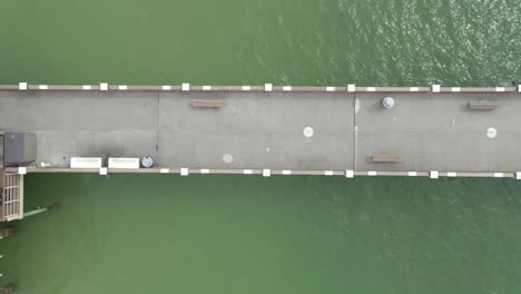Aerial-top-down-view-of-people-walking-on-Pier-60-in-Clearwater-beach,-Florida