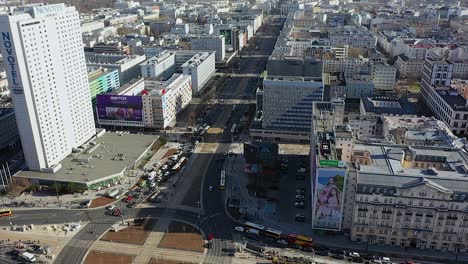 Aerial-drone-view-overlooking-traffic-on-the-Marshal-Street-in-sunny-Warsaw,-Poland