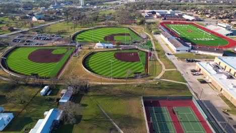 Aerial-footage-of-the-baseball-fields,-tennis-courts-and-football-fields-for-Melissa-middle-school