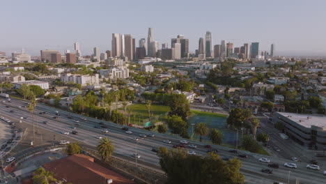 Above-the-City-of-Angels,-Aerial-Drone-Establishing-Shot-of-Los-Angeles-Skyline-in-Daytime