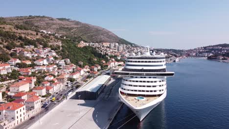 Cruise-Ship-at-the-Harbor-of-Dubrovnik,-Croatia---Aerial-Drone-View