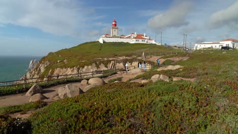 Young-Girls-Enjoying-Strong-Wind-on-Cabo-da-Roca---Popular-Destination-between-Sintra-and-Cascais