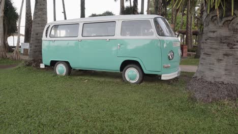 A-tilt-reveal-of-a-beautifully-restored-classic-Volkswagen-Van-parked-on-a-beach-in-Pattaya,-Chon-Buri,-Thailand