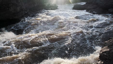 Sunset-lens-flare-over-raging-river-rapids