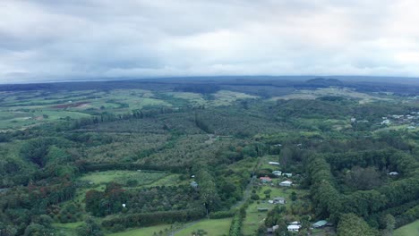 Wide-aerial-dolly-shot-of-rural-rainforest-and-farmland-on-the-Big-Island-of-Hawaii