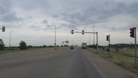 Traveling-in-the-Chicago-Illinois-area,-suburbs,-streets,-and-highways-in-POV-mode-at-stop-light